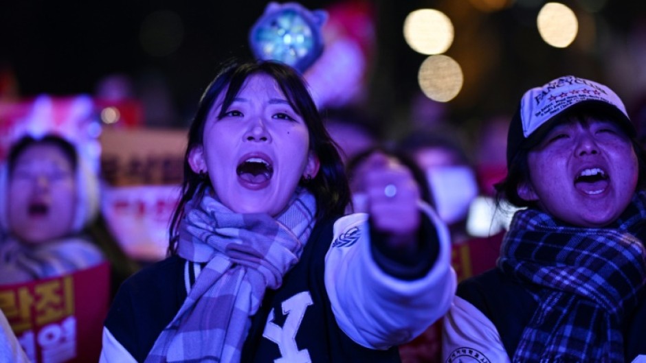 People take part in a protest calling for the ouster of South Korean President Yoon Suk Yeol outside the National Assembly in Seoul on Saturday