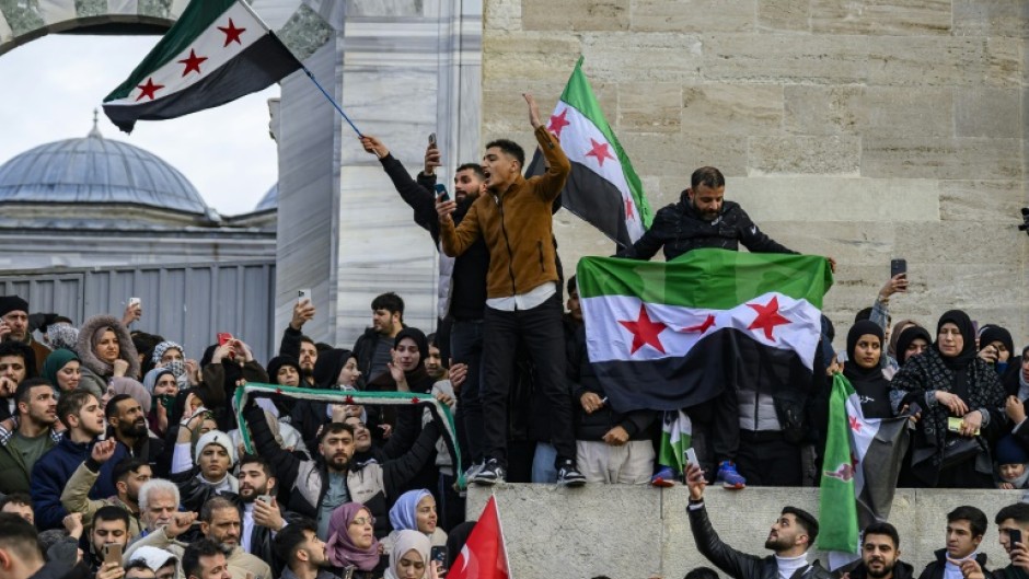 Syrians in Istanbul celebrate the reported fall of the Assad regime