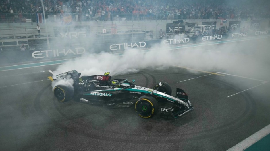 Final twist: Lewis Hamilton does a donut at the end of his last Mercedes rive at the Abu Dhabi Grand Prix