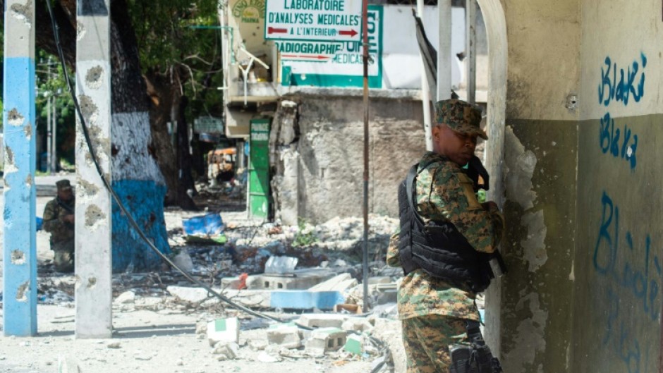 Police forces take part in an operation against powerful gangs in the city center near the National Palace in Port-au-Prince on July 9, 2024