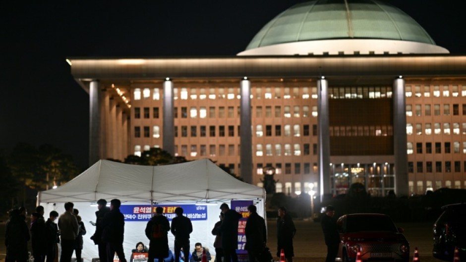 Demonstrators take part in a sit-in protest calling for the ouster of South Korea President Yoon Suk Yeol on the grounds of the National Assembly in Seoul 