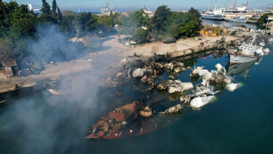 An aerial photo shows Syrian naval ships destroyed in an overnight attack on the port city of Latakia 