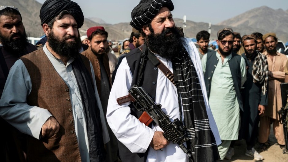 The Afghan minister for refugees Khalil Ur-Rahman Haqqani never appeared in public without an automatic weapon in his hand