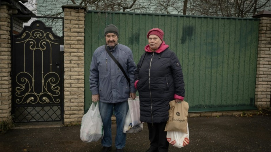 'Prices are going up every day,' said Viktor Markov, returning from shopping with his wife