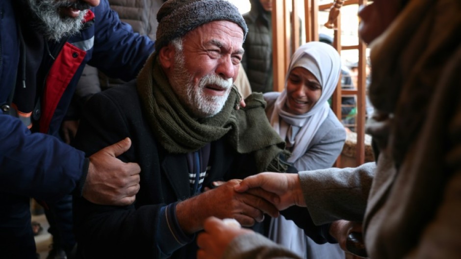 Grief-stricken relatives gather outside the Nasser Hospital in Khan Yunis following the latest Israeli air strikes on southern Gaza.