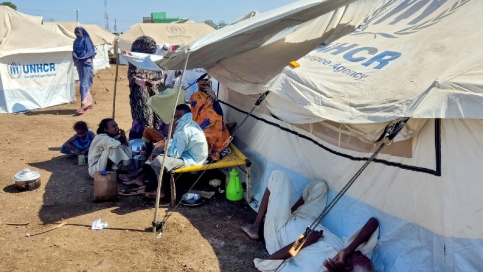 Sudanese who fled violence in Al-Jazira state rest at a camp for the displaced in the eastern city of Gedaref