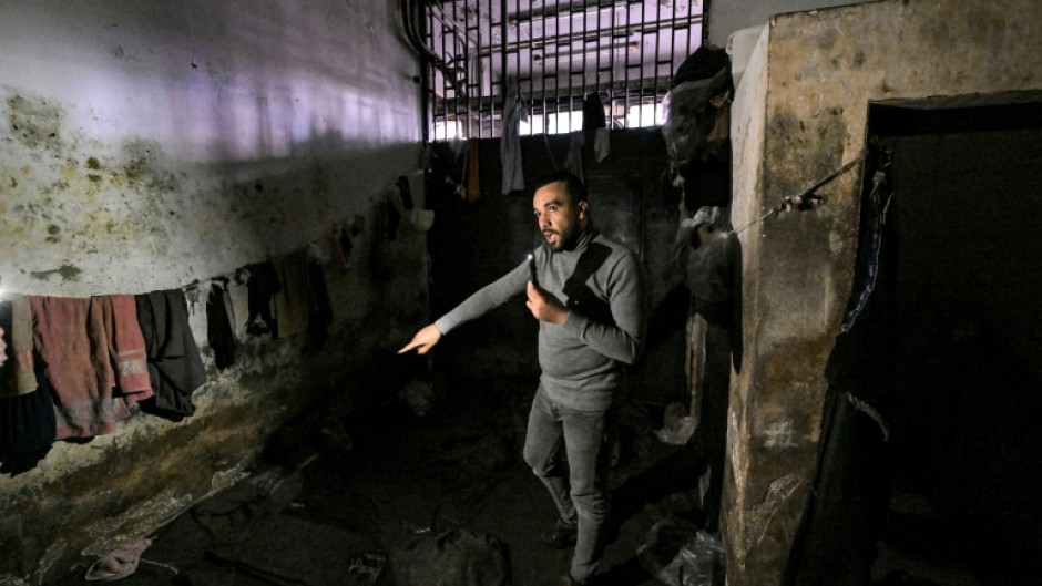 Former prisoner Mohamed Darwish gives AFP a guided tour of the feared detention centre of the Palestine Branch of Syrian military intelligence where he was interrogated for 120 days