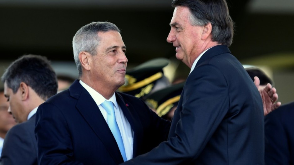 Brazilian general and former defence minister Walter Braga Netto (L), seen with far-right ex-president Jair Bolsonaro, has been arrested over an alleged coup plot, according to a police source