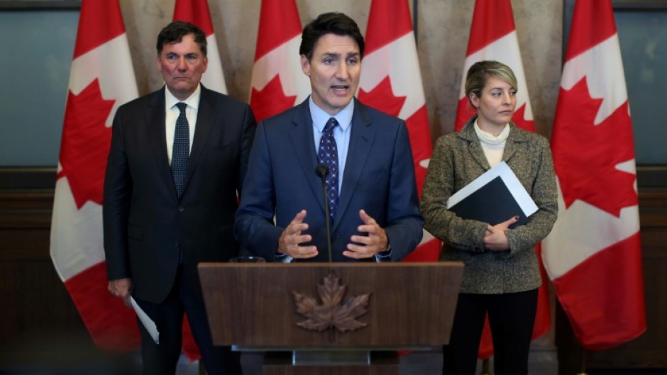 Canadian Prime Minister Justin Trudeau (C) faces a political crisis with the shock resignation of Chrystia Freeland as finance minister, a position that has been swiftly filled by Public Safety Minister Dominic LeBlanc (L)