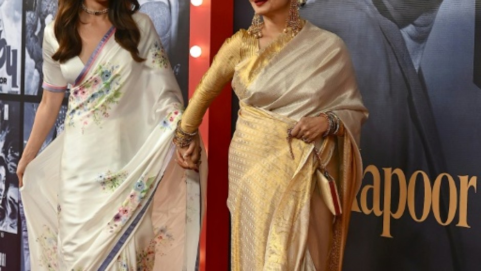 Bollywood actors Alia Bhatt (L) and Rekha at an event marking the 100th birth anniversary of legendary Indian actor and filmmaker Raj Kapoor