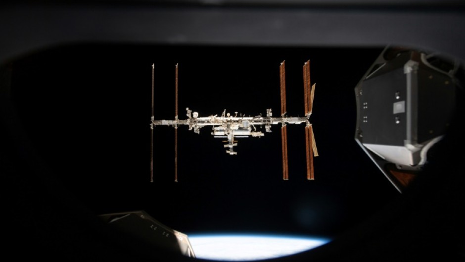 This handout image released by NASA on September 19, 2024 shows the International Space Station photographed from inside the SpaceX Crew Dragon Endeavour 