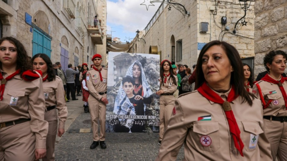 A small parade of Palestinian scouts included banners speaking out against the war in Gaza