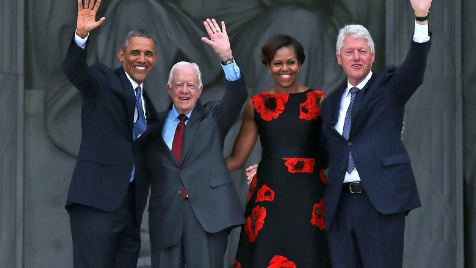 Former presidents including Barack Obama and Bill Clinton, pictured here with Jimmy Carter in 2013, paid tribute to the one-time peanut farmer and Nobel laureate