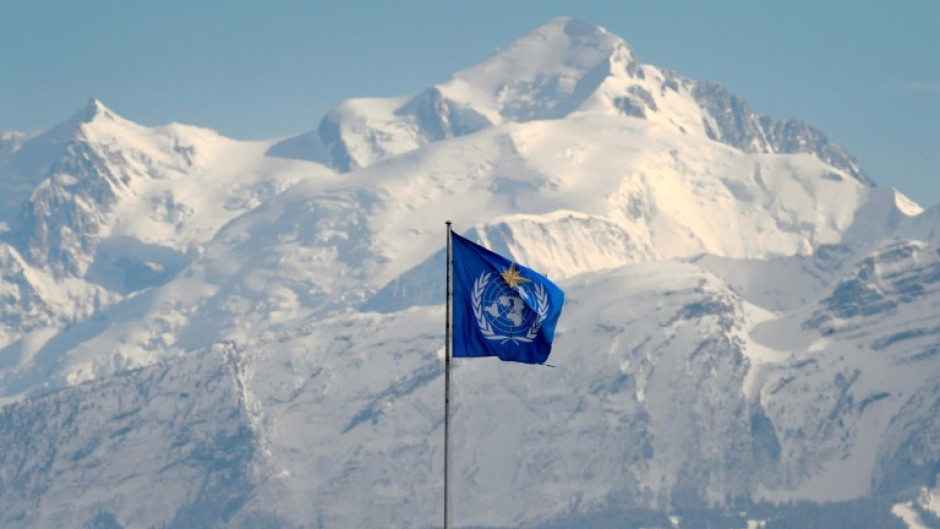 The WMO flag flies on top of its headquarters in Geneva, in front of the Mont Blanc massif