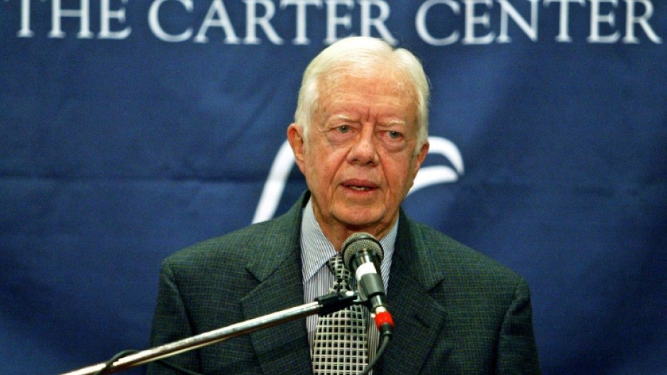 Former US President Jimmy Carter, pictured at a 2004 press conference, was a noted humanitarian in his post-presidency