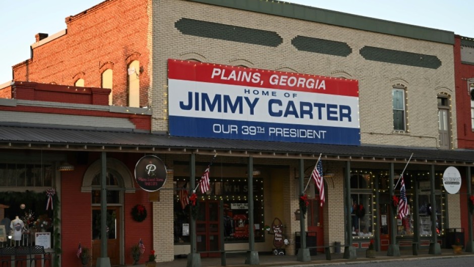 A sign has long hung in downtown Plains, Georgia heralding Jimmy Carter as the 39th president