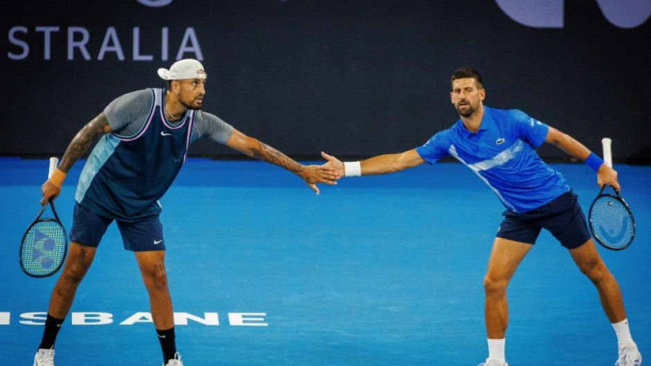 Australia’s Nick Kyrgios (L) and Serbia’s Novak Djokovic (R) lost in the doubles at the Brisbane Interational