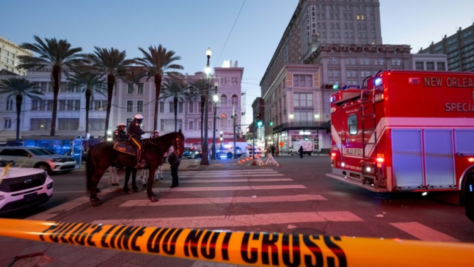 Early morning on New Year's Day as police cordon off the intersection of Canal Street and Bourbon Street in New Orleans after a truck plowed into a crowd of revellers, killing at least 15 people