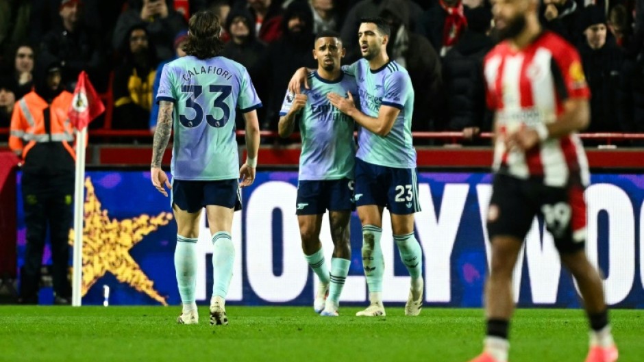 Arsenal's Gabriel Jesus (C) celebrates after scoring against Brentford