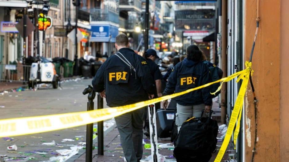 FBI investigators scour the New Orleans scene of a mass casualty attack by a man in a Ford pickup truck, who drove into a New Year's crowd