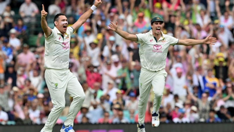 Australia Scott Boland (L) and Pat Cummins celebrate during the fifth Test against India in Sydney