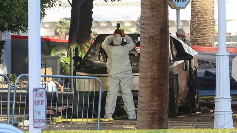 An investigator photographs the Tesla Cybertruck that exploded outside Trump International Hotel in Las Vegas 