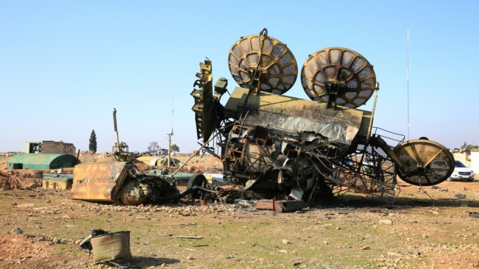 A damaged mobile military radar at a position of Syria's former army south of Aleppo, after a war monitor reported Israeli strikes