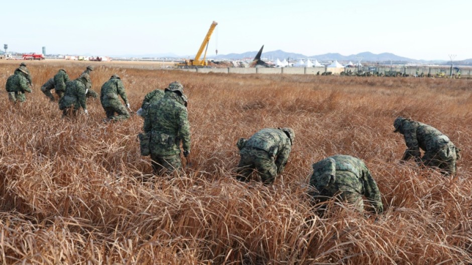 Soldiers have scoured the site of the Jeju Air passenger plane crash