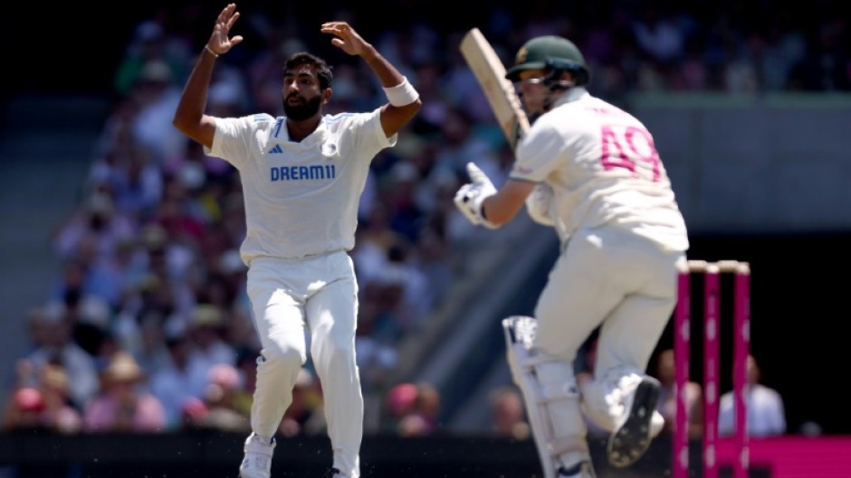 India’s captain Jasprit Bumrah (L) reacts after Australia’s Steve Smith hit a shot during day two of the fifth Test