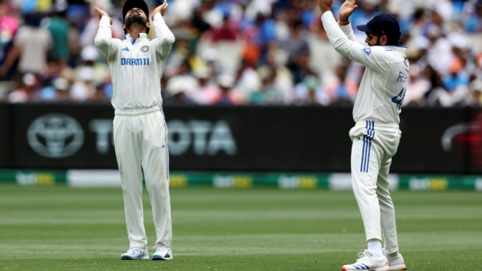 India's Virat Kohli (L) and Rohit Sharma during the fourth Test in Melbourne