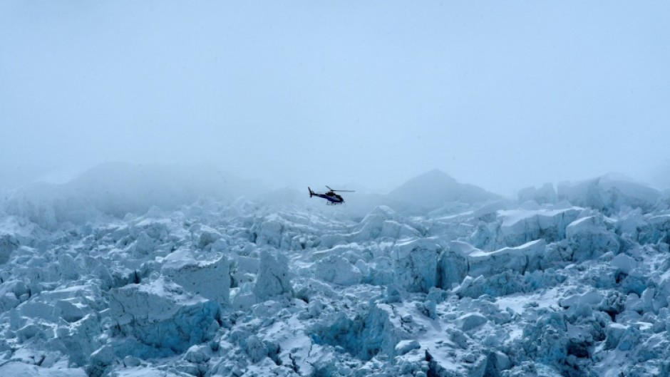 A helicopter flies over Mount Everest on May 2, 2021