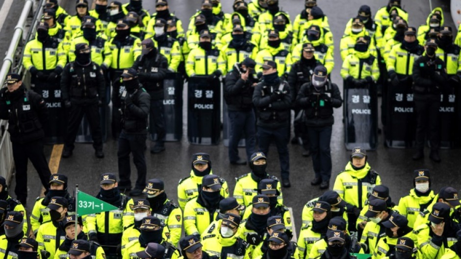 Police officers in Seoul as people gather for a rally near President Yoon Suk Yeol's residence 