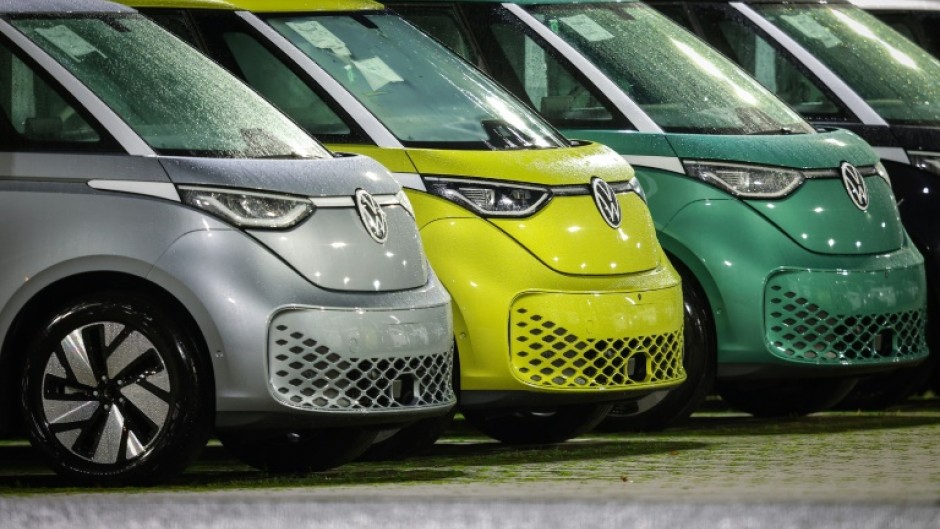 New VW ID Buzz vehicles next to the commercial vehicle plant of German car manufacturer Volkswagen (VW) in Hanover, northern Germany, before delivery on 19 December 2024