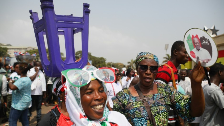 The jubilant crowd wore the green, red, black and white of Mahama's National Democratic Congress