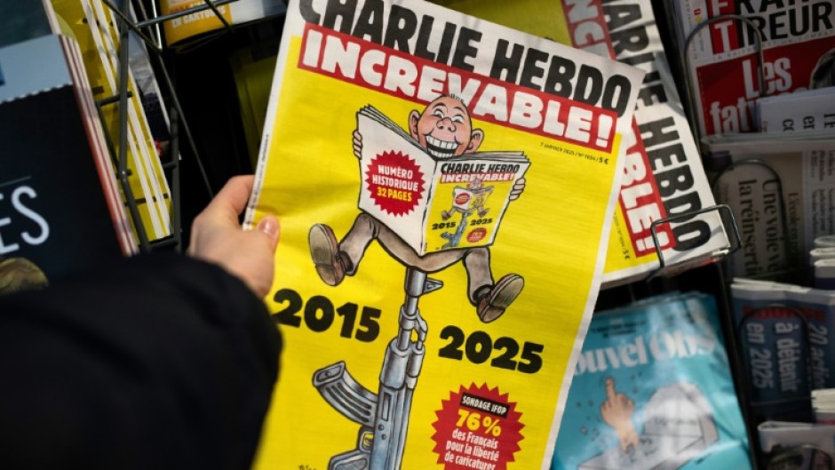 The front page of Charlie Hebdo featuring a reader sitting on an AK-47 with  the caption 'Indestructible'