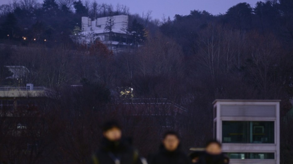 The residence (top) of South Korea's impeached President Yoon Suk Yeol is seen in Seoul before an arrest warrant deadline passed