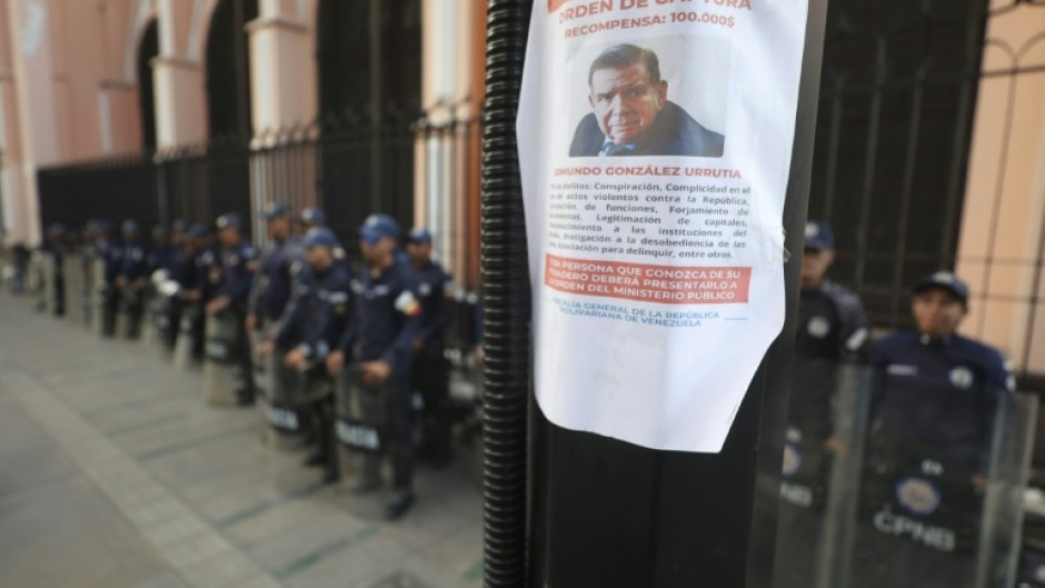 A poster asking for information on Venezuelan opposition leader Edmundo Gonzalez Urrutia is pictured in a pole amid heavy security in Caracas on January 8, 2025