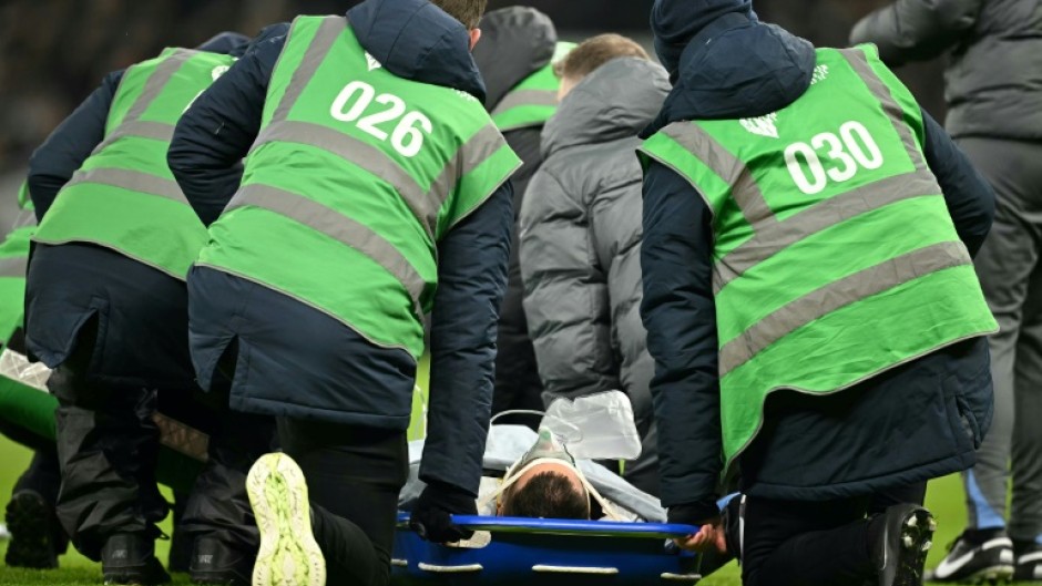 Tottenham's Uruguayan midfielder Rodrigo Bentancur on a stretcher before being carried off