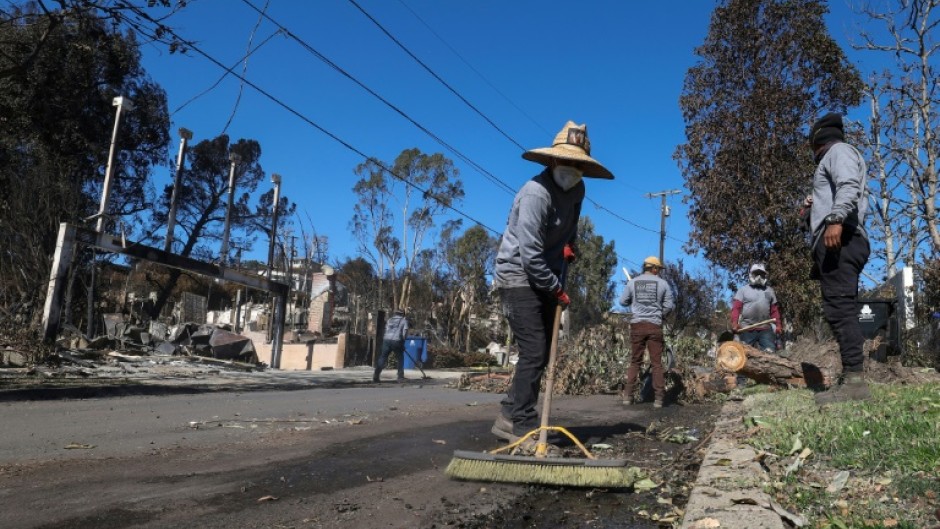 Some locals are not waiting for the official clean up and have started fixing the streets themselves