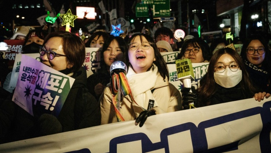 Young women and supporters of liberal causes like the LGBTQ+ community, climate justice and labour rights are calling for the impeached president's immediate detention