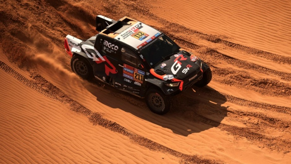 South African driver Henk Lategan and South African co-driver Breet Cummings compete during Stage 8 of the Dakar Rally