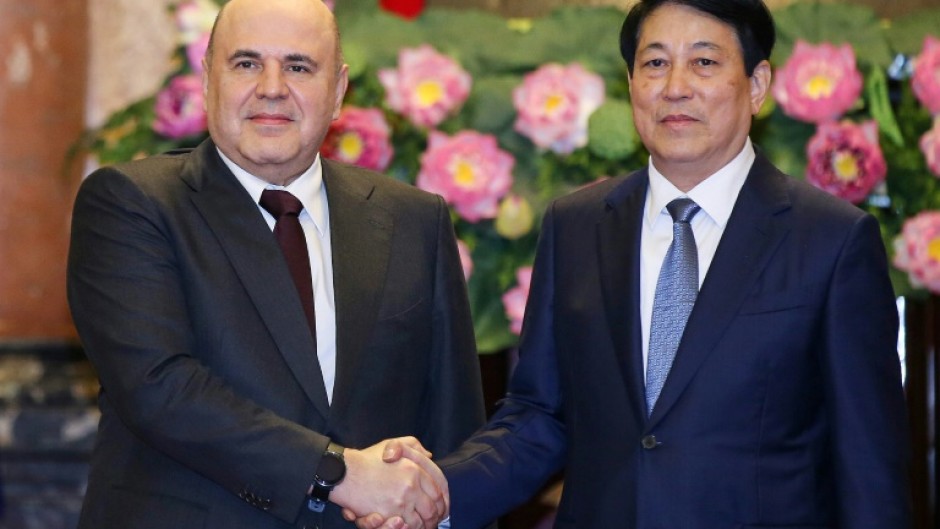 Vietnam's President Luong Cuong (right) and Russia's Prime Minister Mikhail Mishustin at the Presidential Palace in Hanoi