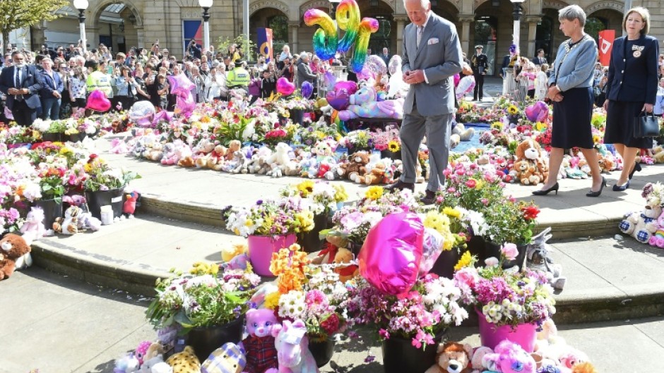 Britain's King Charles III views tributes placed outside Southport Town Hall following the July 29, 2024 attack at a childrens' Taylor Swift themed dance party