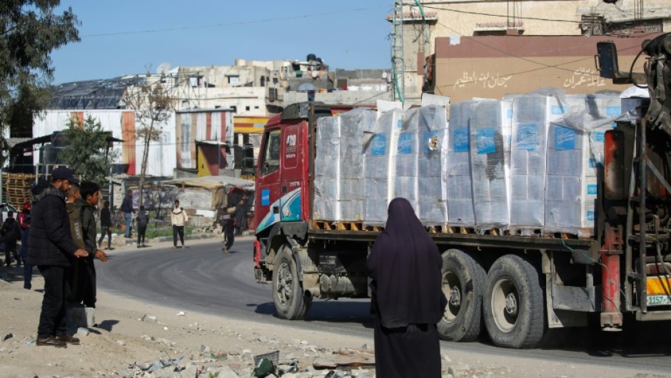 A truck carrying much needed humanitarian aid drives through southern Gaza's Rafah