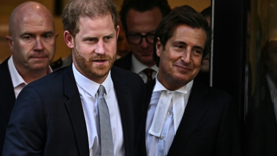 Prince Harry leaves court with his barrister, David Sherborne, after testifying in June that he had suffered lifelong press invasions