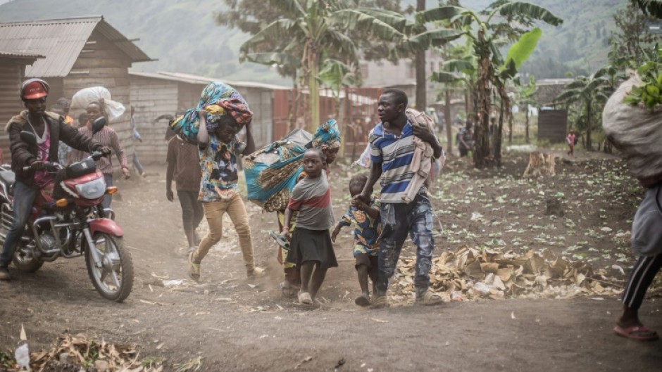 People in eastern DR Congo flee the area of Minova seized by M23 fighters