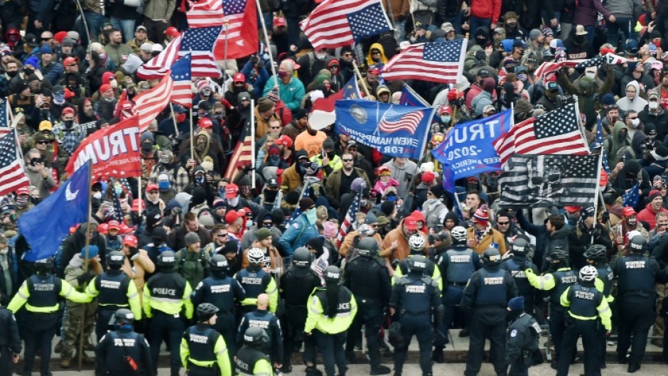 Trump supporters clash with police as they storm the US Capitol in Washington on January 6, 2021