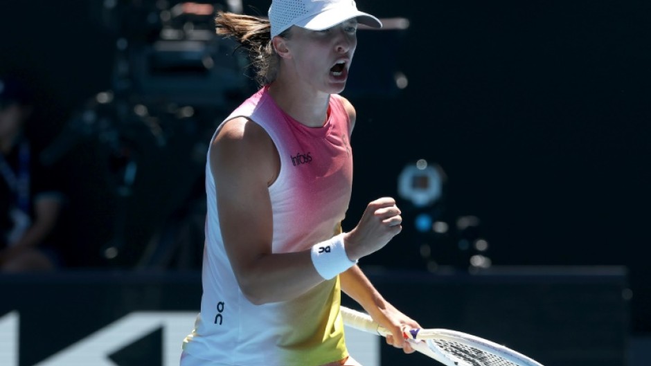 Iga Swiatek celebrates her quarter-final victory over Emma Navarro