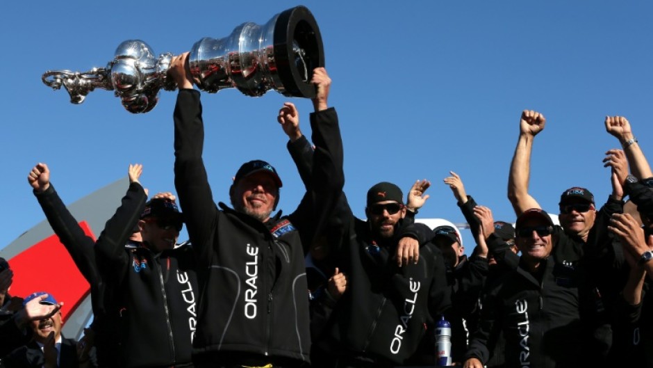 Oracle CEO Larry Ellison and Oracle Team USA celebrates onstage in San Francisco after the America's Cup in 2013