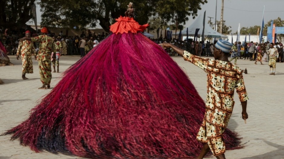 A swirling Zangbeto performs at the Voodoo Festival in Ouidah on January 10, 2025